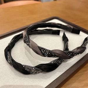 Detail showing non-slip teeth and braided silk fabric with crystals on headbands