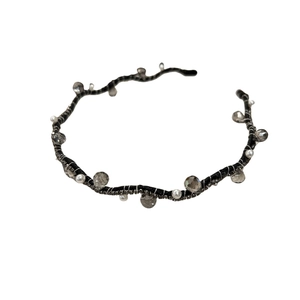 Elegant wave-shaped black headband with grey crystal beads and white faux pearls