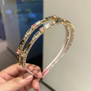 Macro shot of double-layered gold headband with colorful crystal rhinestones