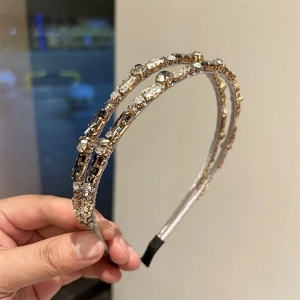 Close-up of double-layered headband with crystal rhinestones and protective end caps