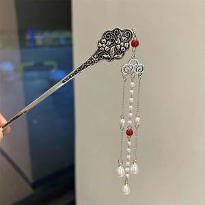 Close-up of silver flower hairpin with red beads and white pearl tassels for Hanfu