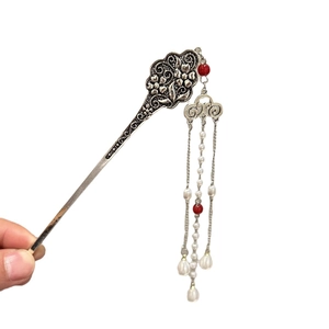 Traditional Chinese silver hair stick with floral carvings, red beads and pearl tassels