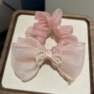 Pink mesh scrunchie with white pearl double-heart decor and elegant satin bow