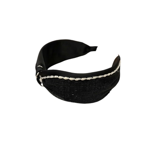 Classic black fabric headband with white contrast stitching and elegant side knot detail