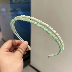 Elegant double-layered headband with white pearls and light green crystals for women
