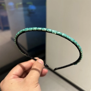 Elegant thin black headband with shimmering turquoise square beads for women's hair styling