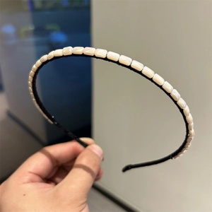 Elegant thin headband with pearlescent rectangular bead accents for women in black