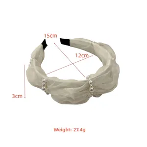 Detailed view of cream silk headband with pearls and specific product dimensions
