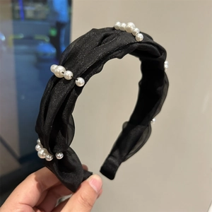 Elegant woven black gauze headband with white pearl accents in a wide twisted style