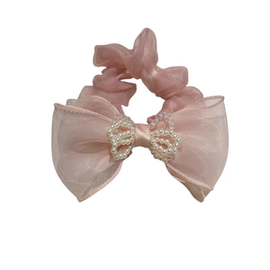 Pink mesh bow scrunchie with elegant pearl accents and elastic hair tie for women