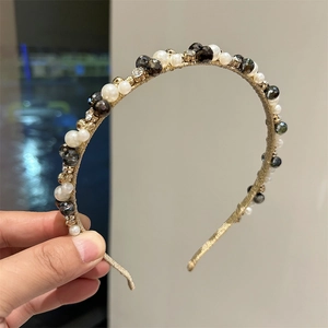 Handmade headband with white pearls, black faceted beads and crystals on a gold wire base