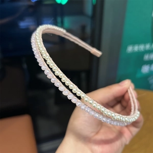 Detail of double-layered headband with white pearls and pink faceted crystal beads