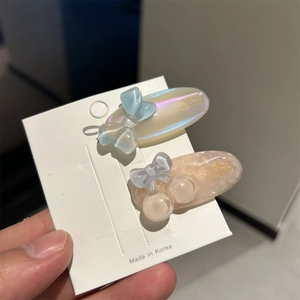 Minimalist acetate hair clips with translucent bows and pearlescent oval bases in a set