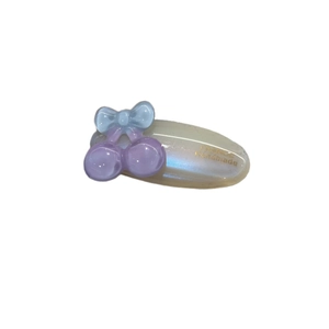 Elegant oval acetate hair clip featuring a translucent cherry design and handmade finish