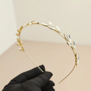 Vintage gold leaf headband with sparkling marquise rhinestones in a vine design