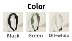 Detail of twisted silk pearl headbands in black, green and beige colors on a platform
