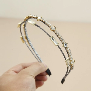 Detailed close-up of handmade double-row crystal headband with elegant beads and clear rhinestones