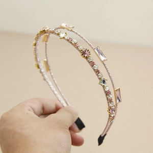 Detail of pink double-layered crystal headband with hand-beaded rhinestones