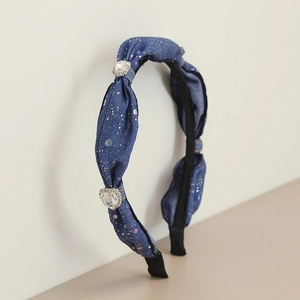 Blue denim headband with colorful splattered prints and large crystal embellishments