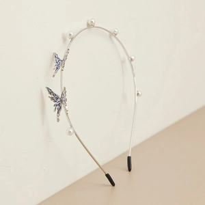 Elegant thin silver metal headband with white pearls and blue enamel butterflies
