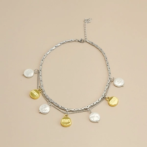 Chic two-layer necklace featuring silver chain, faux pearls and gold lettered charms