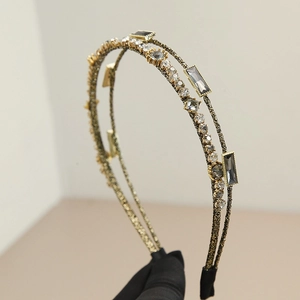 Detail of double-layer hairband with hand-wrapped gold wire, crystals, and rhinestones