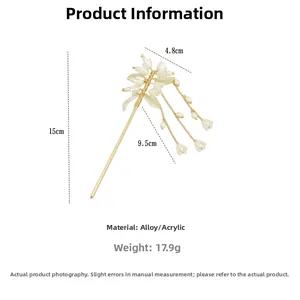 Detailed view of vintage gold lily of the valley hair pin with dimensions and tassels