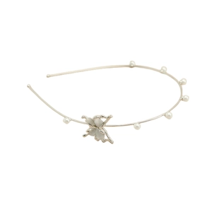 Detailed shot of silver butterfly metal headband featuring opal stones and white pearls