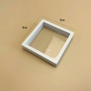 Detailed view of white 9cm square 3D floating jewelry display box with transparent PE film