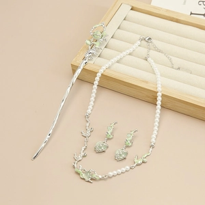 Detail of irregular silver necklace with green opal stone and pearl accents