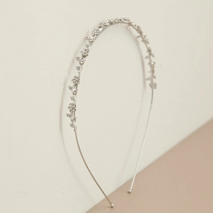 Elegant silver flower headband with rhinestone crystals on a minimalist thin metal frame