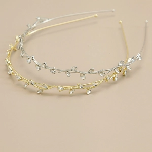 Elegant gold and silver twig headband set with sparkling marquise and round cubic zirconia