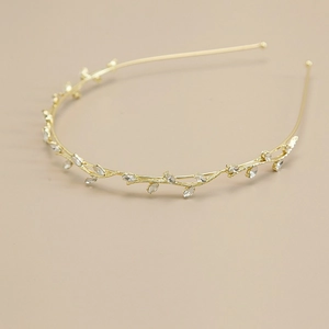 Elegant gold metal headband featuring sparkling leaf-shaped zircon crystals and rhinestones