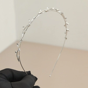 Detail of silver fairy zircon headband with fine sparkling crystal vine pattern design