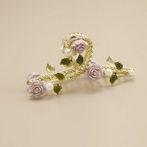 Elegant gold metal hair claw clip with pink roses, green leaves and pearls for women