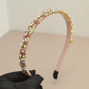 Sparkling crystal headband with colorful rhinestones on elegant pink fabric wrap