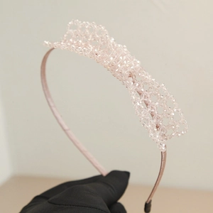 Elegant handmade pink crystal beaded bow headband with intricate weaving for women