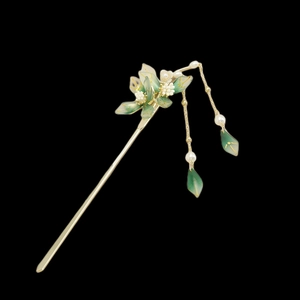 Elegant Chinese hair stick with white flowers and green leaf tassels on black background