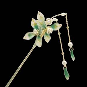 Elegant Chinese hair pin with green floral petals and golden tassel pendents