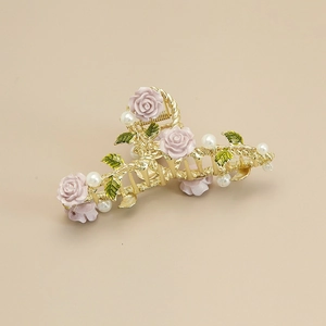 Elegant gold alloy hair claw with purple resin roses, green leaves, and white pearls