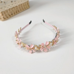Serre-tête floral rose avec feuilles dorées, perles et cristaux pour un style élégant