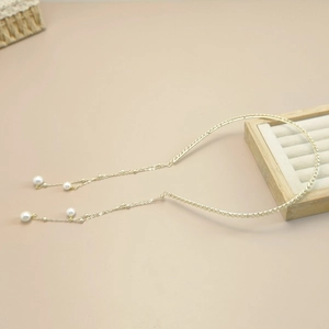 Serre-tête élégant en métal doré avec de longs glands en perles pour accessoire cheveux
