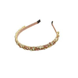 Elegant headband with pink and yellow crystals on a metal base with non-slip lining