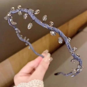 Minimalist crystal woven headband featuring light blue braid and sparkling glass pendants