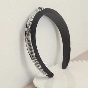 Elegant wide black padded headband with sparkling rhinestones for a sophisticated style