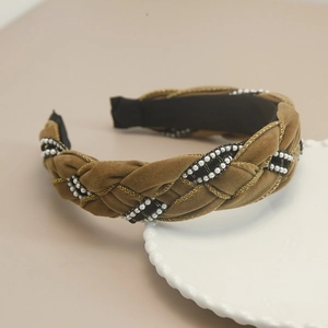 Detail of twisted woven headband with camel velvet, plaid ribbon, and pearls