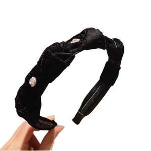 Elegant black velvet twisted headband with sparkling rhinestones for retro hair styling