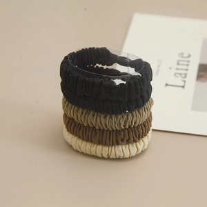 Lot de quatre chouchous en tissu élastique aux tons neutres pour cheveux femme