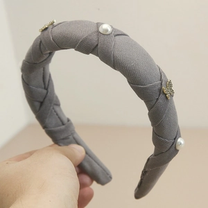 Gray wide twisted headband with pearl accents and sparkling golden crystal butterflies