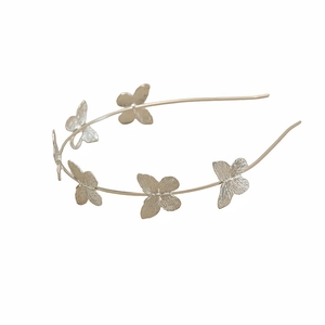 Elegant silver metal headband featuring five textured butterflies for photography and parties
